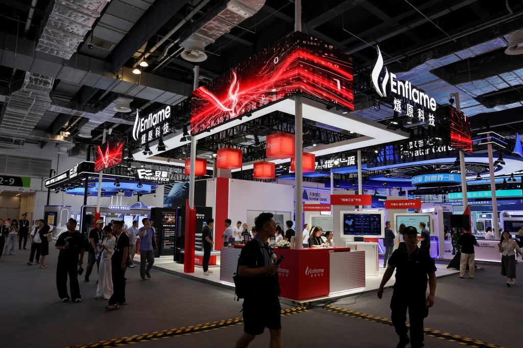 People walk past the Enflame booth during the World Artificial Intelligence Conference (WAIC) in Shanghai, China, July 17, 2026. REUTERS/Go Nakamura.