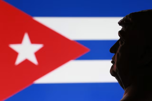 A 3D printed miniature of U.S. President Donald Trump and Cuban flag are seen in this illustration taken January 9, 2026. REUTERS/Dado Ruvic/Illustration