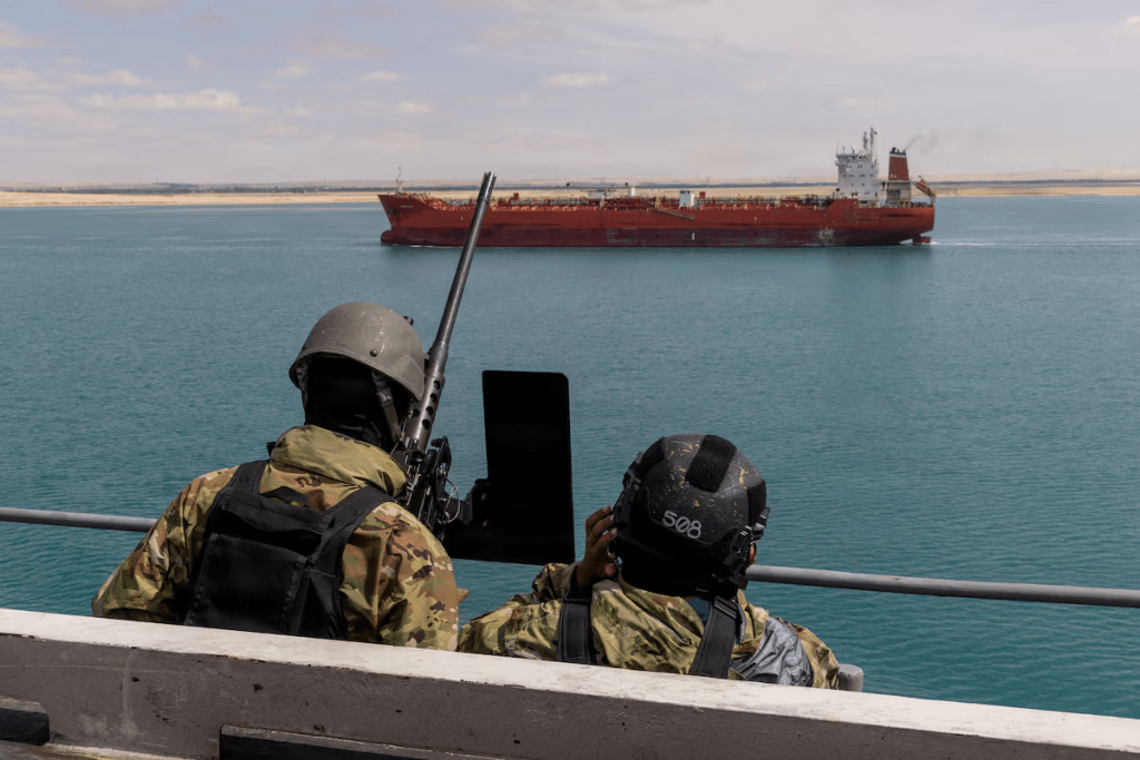 U.S. Navy sailors stand small craft action team watch on a catwalk of the aircraft carrier USS Gerald R. Ford as it transits the Suez Canal, en route to support the Operation Epic Fury attack on Iran, in Egypt March 5, 2026. U.S. Navy/Handout via REUTERS