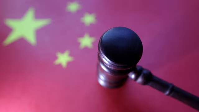 Chinese flag and Judge gavel are seen in this illustration taken, August 6, 2024. REUTERS/Dado Ruvic/Illustration 
