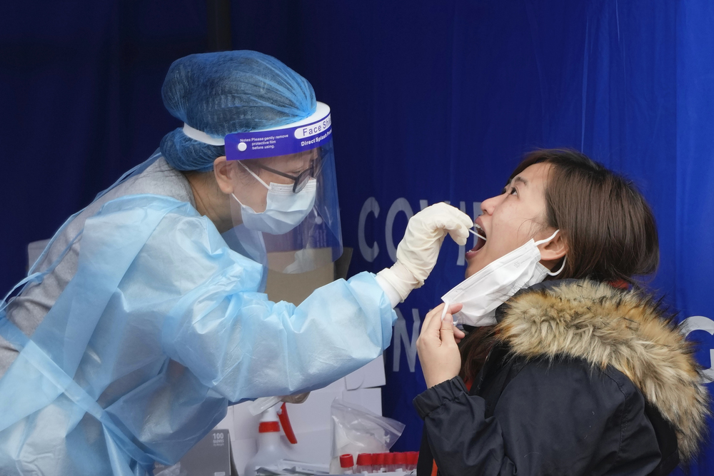 A resident gets tested for the coronavirus at a temporary testing center for Covid-19 in Hong Kong. (AP) A resident gets tested for the coronavirus at a temporary testing center for Covid-19 in Hong Kong. (AP)
