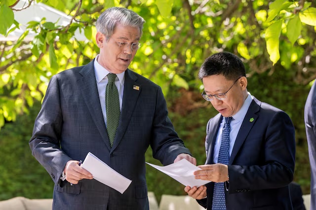 U.S. Secretary of the Treasury Scott Bessent speaks with China's Vice Minister of Finance Liao Min, on the day of a bilateral meeting between the U.S. and China, in Geneva, Switzerland, May 11, 2025. KEYSTONE/EDA/Martial Trezzini/Handout via REUTERS /File Photo