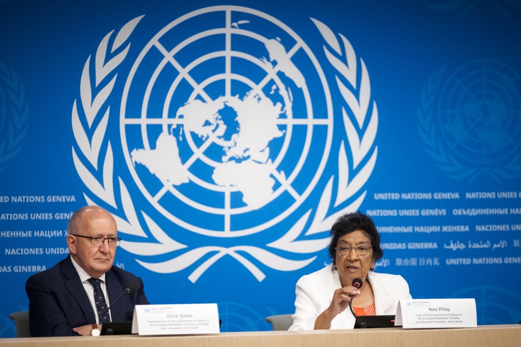 Chair of the Independent International Commission of Inquiry on the Occupied Palestinian Territory, including East Jerusalem, and Israel, South African judge Navi Pillay (R), speaks next to Commission Member Chris Sidoti during a press conference in Geneva on September 16, 2025. (Photo by Fabrice COFFRINI / AFP)