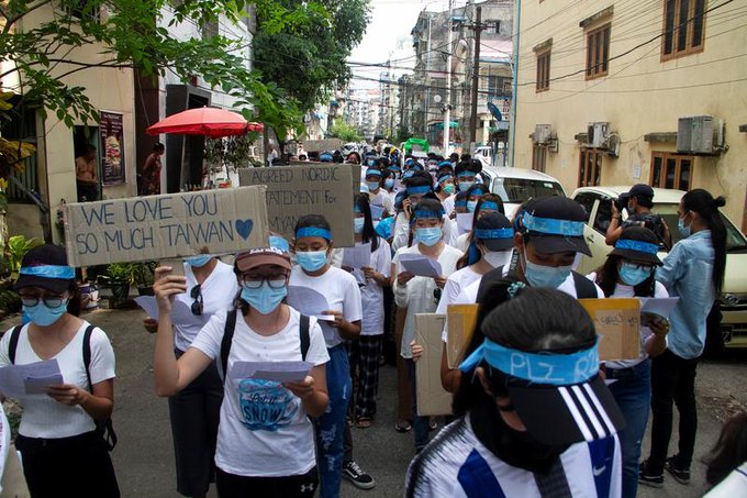 Demonstrators march during a protest against military coup in Yangon, Myanmar April 12, 2021. Demonstrators march during a protest against military coup in Yangon, Myanmar April 12, 2021.