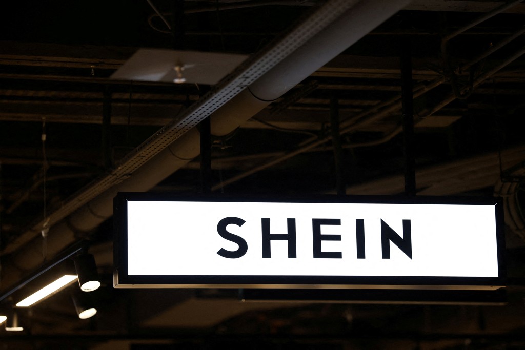 A Shein logo is seen at the first physical space of Chinese online fast-fashion retailer Shein on its opening day inside the Le BHV Marais department store, the Bazar de l'Hotel de Ville, in Paris, France, November 5, 2025. REUTERS