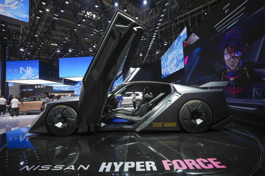 A staff member stands by a Nissan Hyper Force concept car during the China Auto Show in Beijing, China, Friday, April 26, 2024. AP