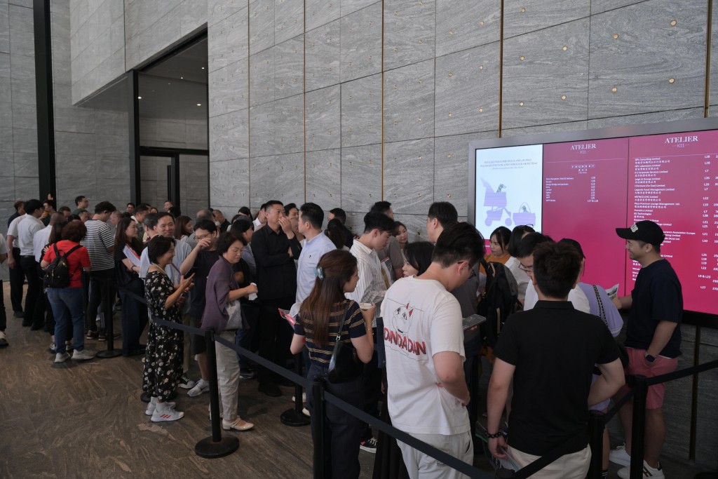 People lines up to buy during the first round sale.