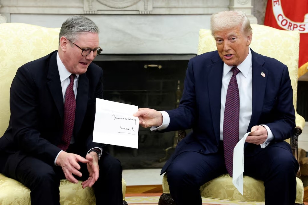 U.S. President Donald Trump holds a letter from Britain's King Charles as he meets with British Prime Minister Keir Starmer in the Oval Office at the White House in Washington, D.C., U.S., February 27, 2025. (Reuters)