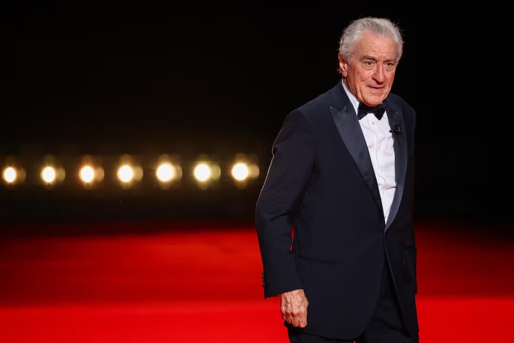 Robert De Niro arrives on stage during the opening ceremony and the screening the film "Partir un jour" (Leave One Day) Out of competition at the 78th Cannes Film Festival in Cannes, France, May 13, 2025. (REUTERS/Sarah Meyssonnier)