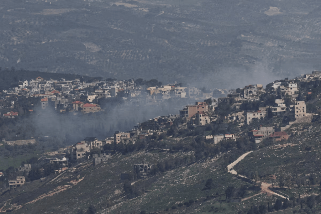 Smoke rises from a Lebanese village near the border with Israel, amid escalation between Iran-backed Hezbollah and Israel, and amid the U.S.-Israeli conflict with Iran, as seen from northern Israel, March 19, 2026. REUTERS/Tyrone Siu/File Photo