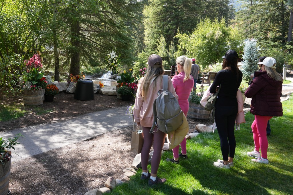 A group of women stand by a makeshift memorial at the Sundance Resort honoring late actor Robert Redford on September 16, 2025, the day he died at the age of 89. Cinema legend Robert Redford, a screen great both in front of and behind the camera whose career spanned six decades, died early on September 16, 2025, at his home in Utah, his publicist said. He was 89. (Photo by GEORGE FREY / AFP)