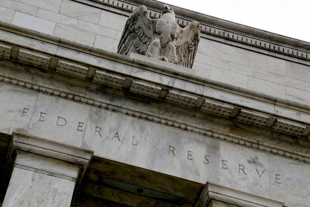 An eagle tops the US Federal Reserve building's facade in Washington, July 31, 2013. REUTERS