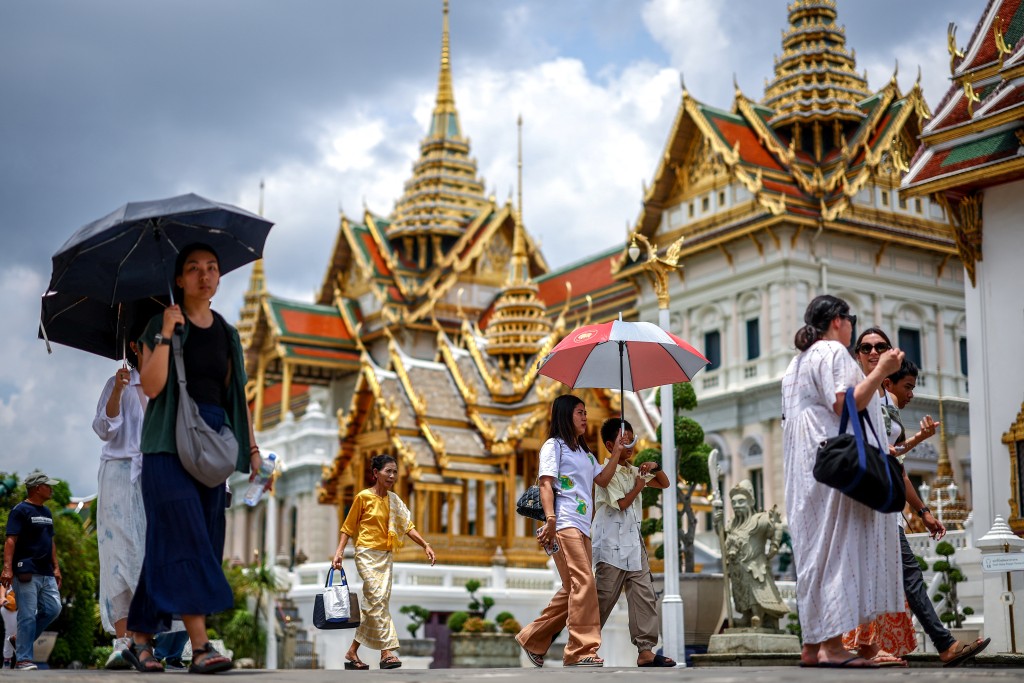 Tourists are seen inside the Grand Palace, one of the favourite tourist spots in Bangkok, Thailand, May 20, 2025. REUTERS/Athit Perawongmetha