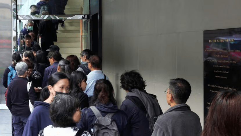 People queue up stairs to enter the Methodist International Church in Hong Kong's Wanchai district on Feb 15, to pay respects to Shiu Ka-chun, a social worker and the city's best-known advocate for prisoners' rights. (Photo: AFP/Justin Chan) People queue up stairs to enter the Methodist International Church in Hong Kong's Wanchai district on Feb 15, to pay respects to Shiu Ka-chun, a social worker and the city's best-known advocate for prisoners' rights. (Photo: AFP/Justin Chan)