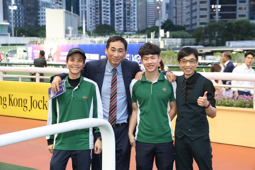 Michael Chang celebrates New Power's win with his stable staff.