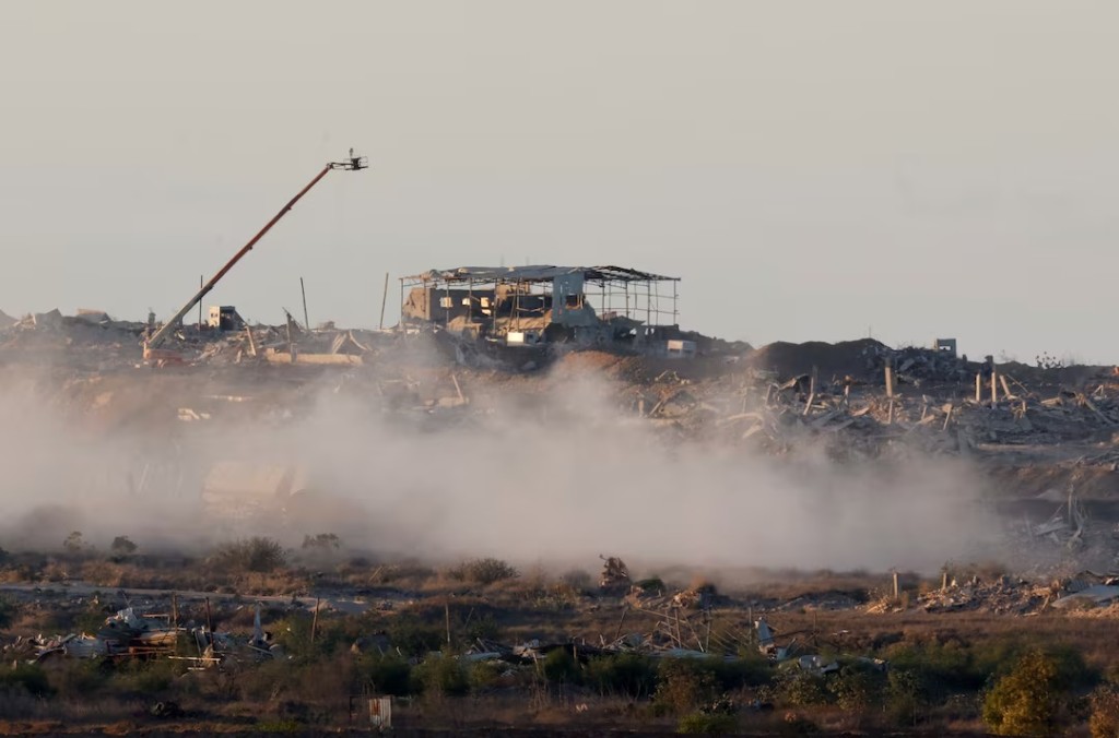 Destroyed buildings following explosions in Gaza, as seen from southern Israel, October 7, 2025. REUTERS/Ammar Awad 