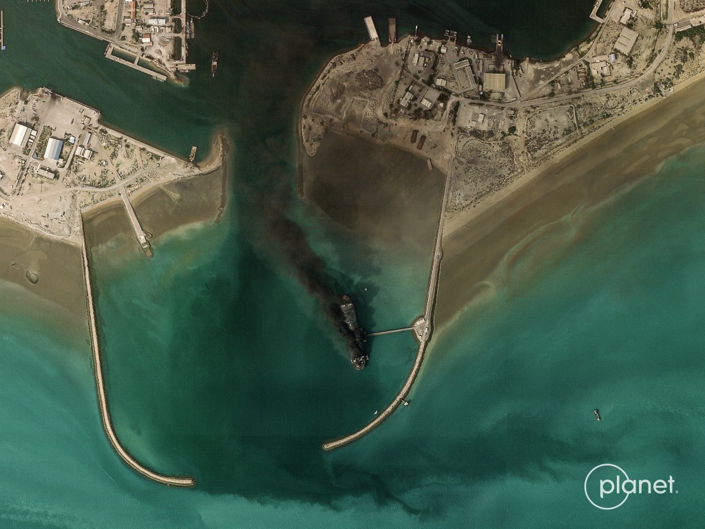 Smoke billowing from a vessel following an explosion from the port of Bandar Abbas along the strait of Hormuz. (AFP)