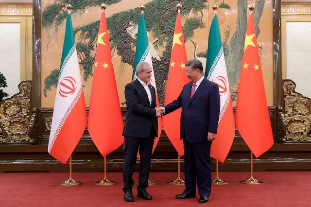 Iranian President Masoud Pezeshkian and Chinese President Xi Jinping shake hands as they meet in Beijing, China, September 2, 2025. Iran's Presidential website/WANA (West Asia News Agency)/Handout via REUTERS/File Photo