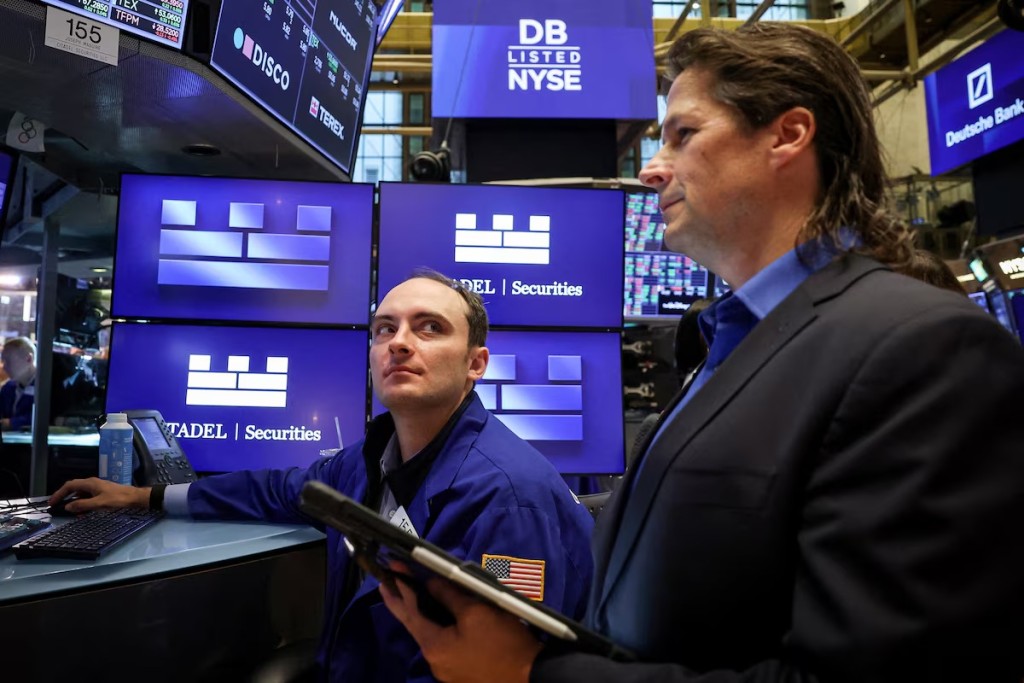 Traders work on the floor at the New York Stock Exchange (NYSE) in New York City, U.S., September 15, 2025. REUTERS