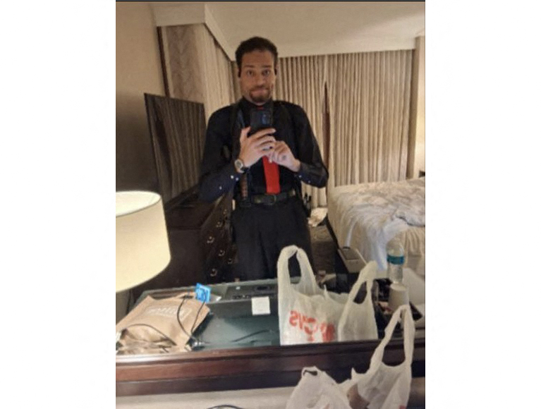 Photo by - / US ATTORNEY FOR THE DISTRICT OF COLOMBIA / AFP  This image released as part of the US Government's Memorandum in Support of Pretrial Detention filed on April 29, 2026 shows a photo the defendant Cole Allen took of himself in a mirror at approximately 8:03pm ET while in his hotel room at the Washington Hilton in Washington, DC, on April 25, 2026, according to the memorandum.