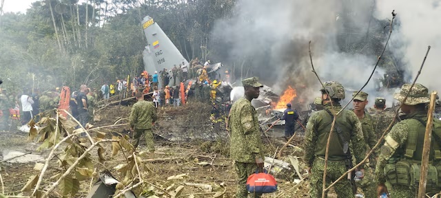 Members of the military gather at the site of a Colombian military plane crash in Puerto Leguizamo, Putumayo, Colombia March 23, 2026. La Voz de Amazonia/Mare Rafue/Handout via REUTERS
