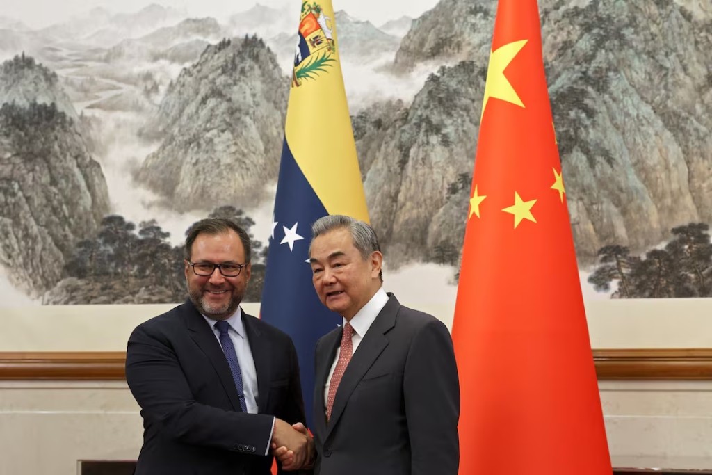 Chinese Foreign Minister Wang Yi and Venezuelan Foreign Minister Yvan Gil Pinto shake hands before their meeting at the Diaoyutai State Guesthouse in Beijing, China May 12, 2025. (Reuters)