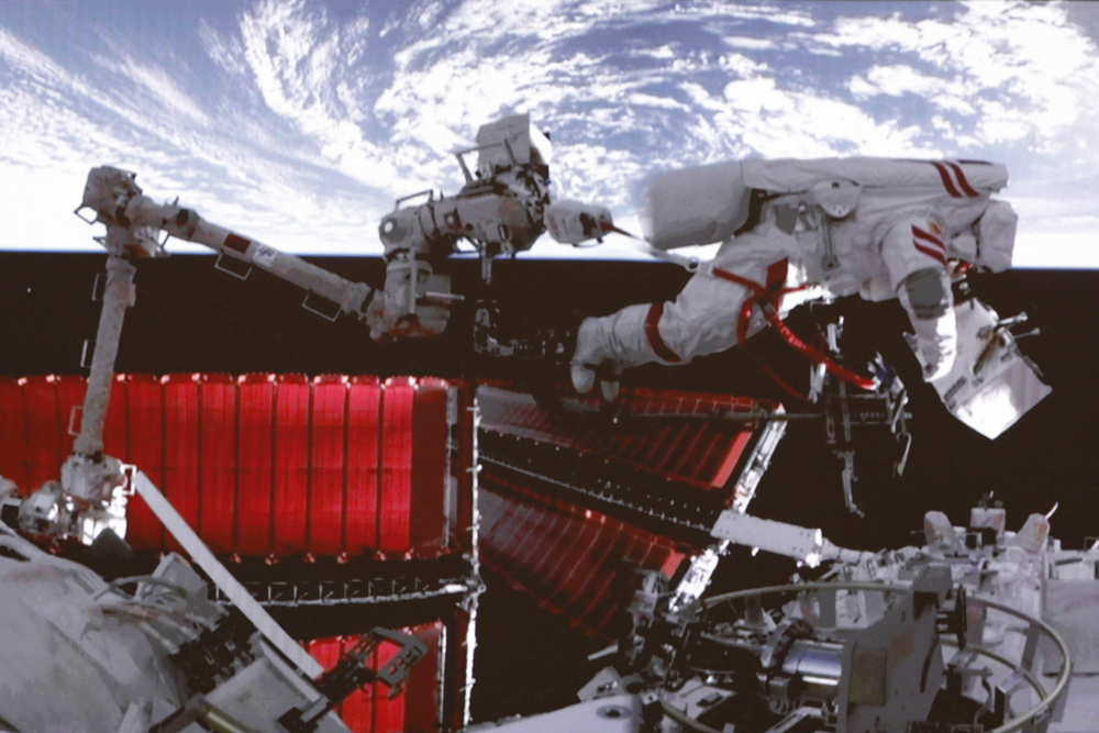 A Chinese astronaut performs a spacewalk outside Tiangong space station, while others conduct experiments in the lab. Below, a model of Tiangong is seen at a conference in Hangzhou. AP, XINHUA, AFP A Chinese astronaut performs a spacewalk outside Tiangong space station, while others conduct experiments in the lab. Below, a model of Tiangong is seen at a conference in Hangzhou. AP, XINHUA, AFP