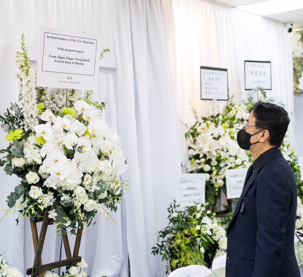 The royal family of Bhutan send a flower wreath to the funeral.