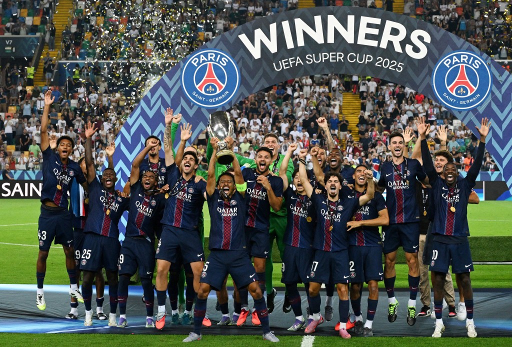 Paris St Germain's Marquinhos lifts the trophy as he celebrates with teammates after winning the UEFA Super Cup. (Reuters)