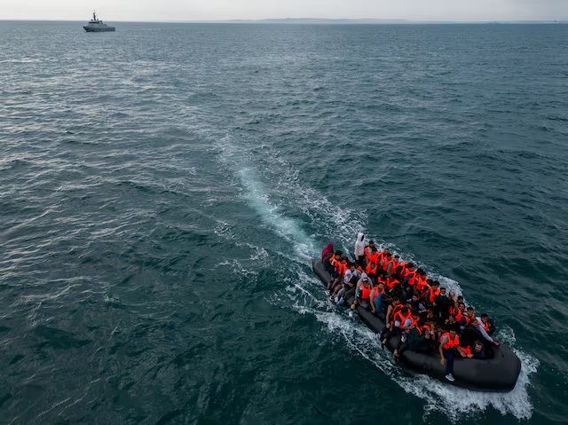 In this drone view an inflatable dinghy carrying migrants makes its way towards England in the English Channel, Britain, August 6, 2024. REUTERS/Chris J. Ratcliffe/File Photo 