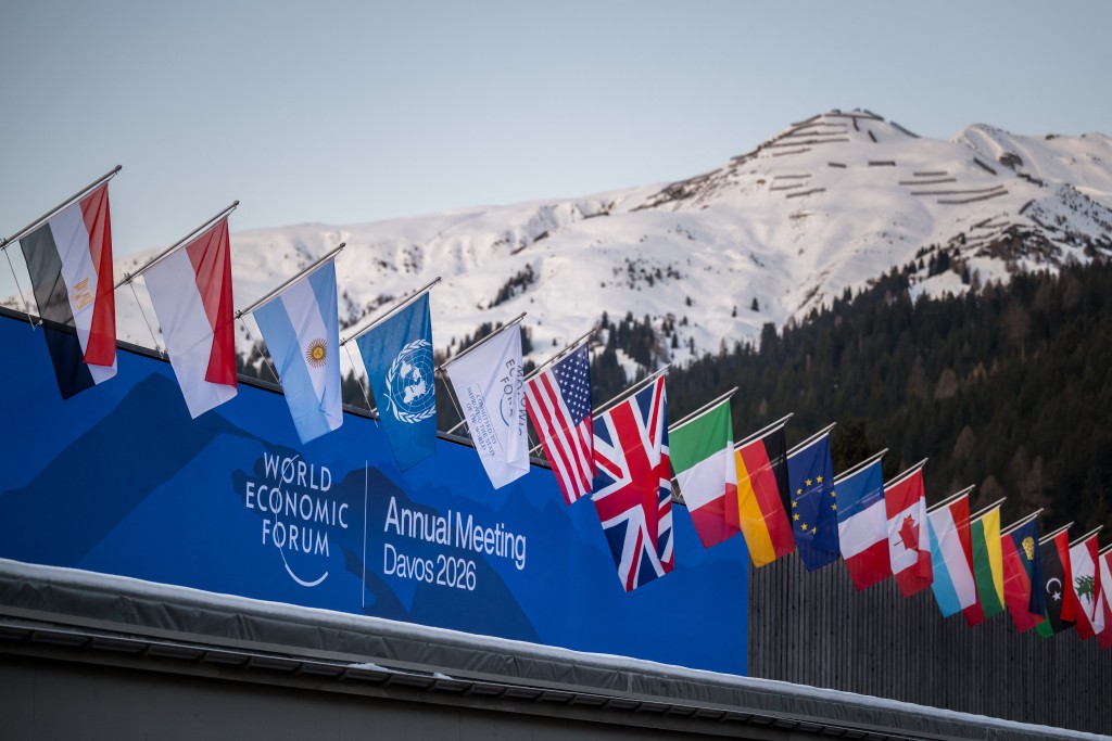 A sign of the World Economic Forum (WEF) is seen on the top of the Congress Centre that hosts the WEF annual meeting in the Alpine resort of Davos on its opening day in Davos on January 19, 2026. (AFP)