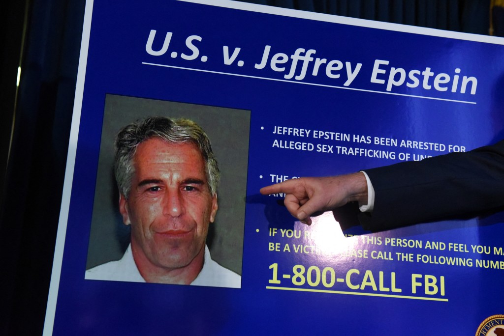 US Attorney for the Southern District of New York Geoffrey Berman points to a photo of Jeffrey Epstein while announcing charges against Epstein during a news conference on July 8, 2019 in New York City. (Photo by STEPHANIE KEITH / GETTY IMAGES NORTH AMERICA / AFP)