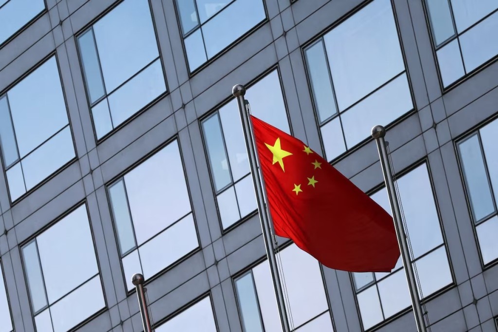 A Chinese flag flutters outside the China Securities Regulatory Commission (CSRC) building on the Financial Street in Beijing, China February 8, 2024. REUTERS  
