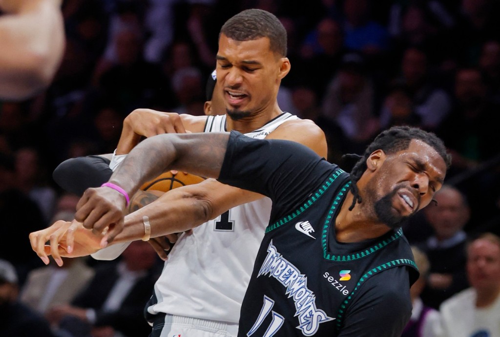 Victor Wembanyama, left, commits a flagrant foul against Naz Reid. REUTERS 