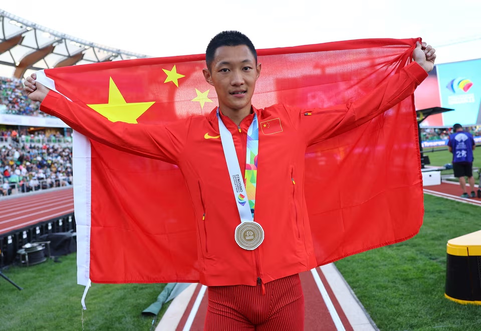 Athletics - World Athletics Championships - Men's Long Jump - Final - Hayward Field, Eugene, Oregon, U.S. - July 16, 2022 Gold medallist China's Wang Jianan celebrates after winning the men's long jump final REUTERS/Kai Pfaffenbach 