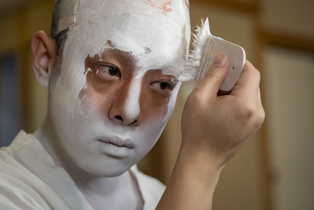 Photo by YUICHI YAMAZAKI / AFP  This picture taken on April 13, 2026 shows kabuki actor Tanenosuke Nakamura applying makeup before his performance at the Kabuki-za Theatre in Tokyo.