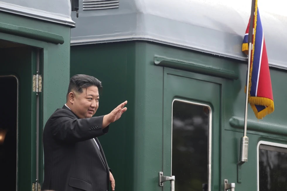 In this photo released by the Government of Primorsky Krai Region, North Korea’s leader Kim Jong Un waves as he boards his train prior to leaving Artyom, near Vladivostok, Russian Far East, Sept. 17, 2023. (Government of Primorsky Krai Region via AP, File)
