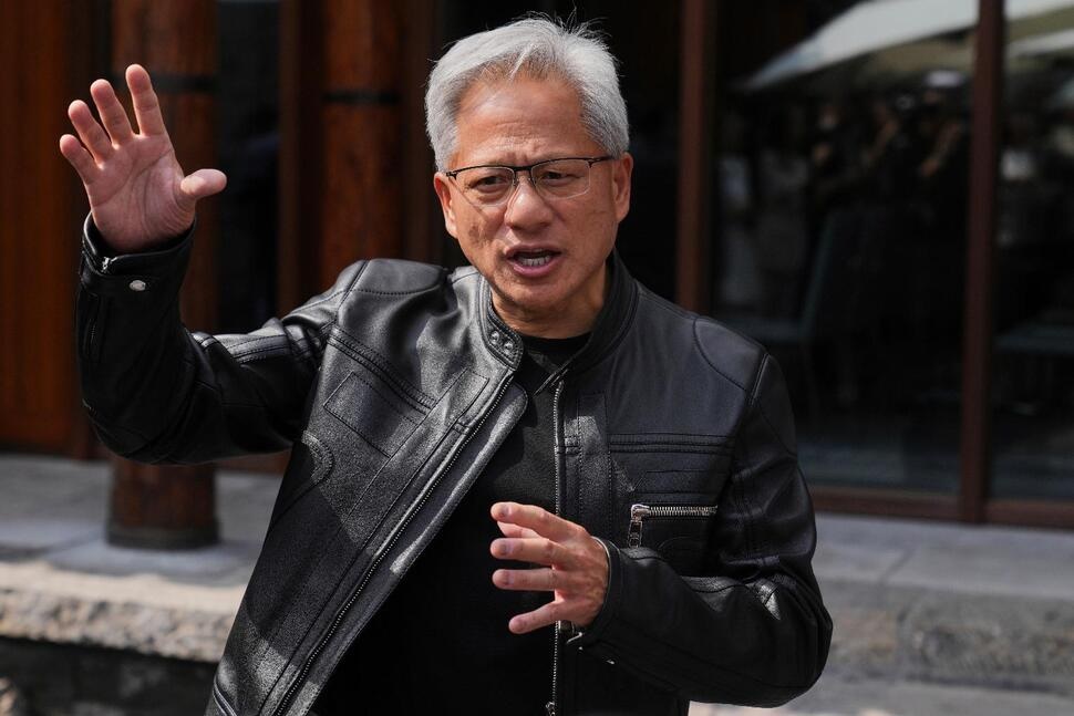 FILE - CEO of Nvidia Jensen Huang speaks during a press conference at the Mandarin Oriental Qianmen after attending the third China International Supply Chain Expo, in Beijing, July 16, 2025. (AP Photo/Andy Wong, File)