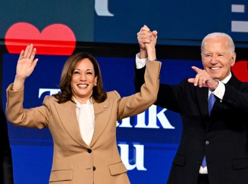 Joe Biden shows he is the ''best volunteer'' for Kamala Harris after his vice president turns up in a sshow of respect for her boss at the Democratic national convention in Chicago with a smile, a hug and a few tears with daughter Ashley.