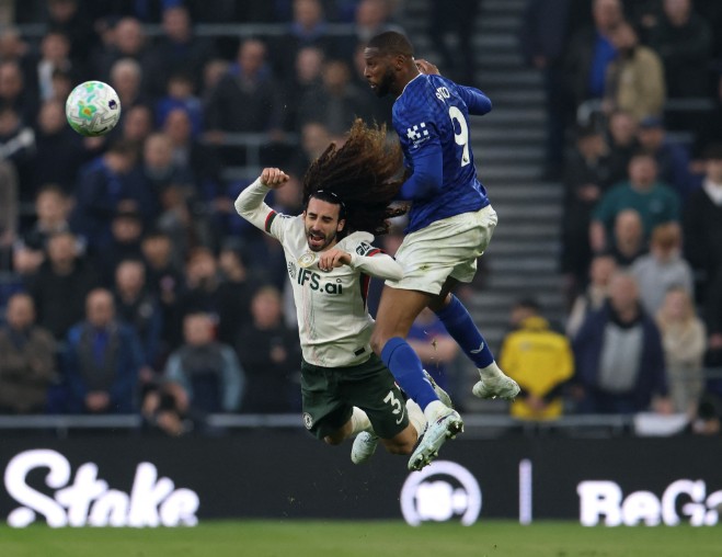 Beto rises above Chelsea defender Marc Cucurella to head the ball. AFP