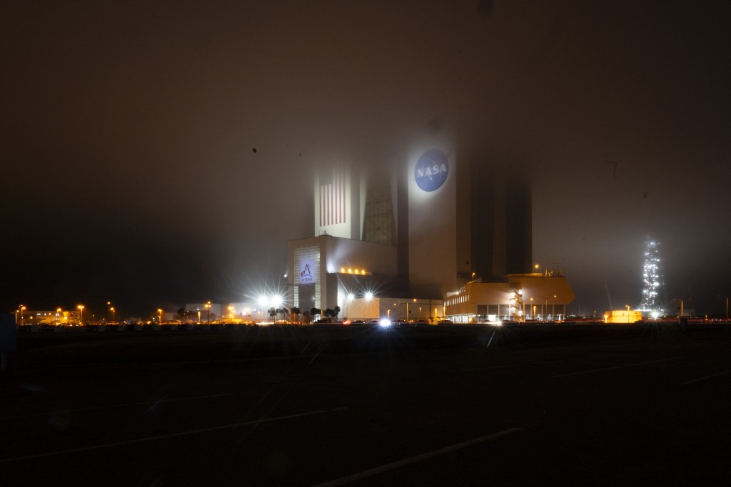 Photo by JIM WATSON / AFP  Early morning fog covers NASA’s Vehicle Assembly Building (VAB) on February 12, 2026, at Kennedy Space Center in Cape Canaveral, Florida.