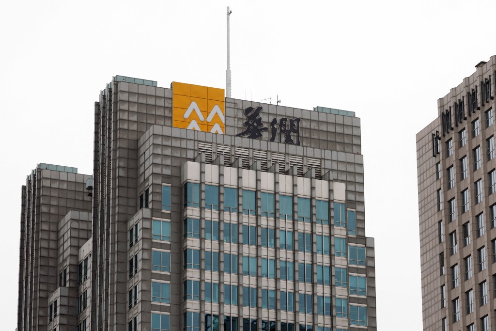 The logo of China Resources (Holdings) Co Ltd is seen on the facade of its building in Beijing, China May 12, 2022. REUTERS