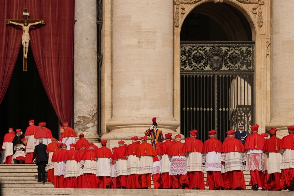FILE - Cardinals walk through St. Peter's Square ahead of Pope Francis' coffin at the Vatican, Wednesday, April 23, 2025. (AP Photo/Andreea Alexandru, File)