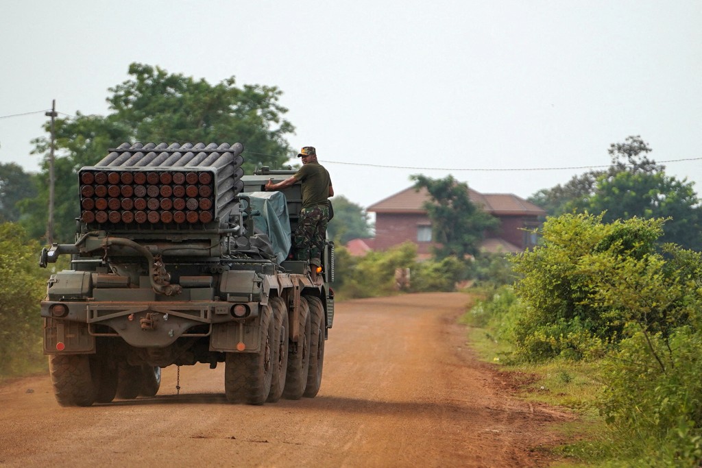 A Cambodian military personnel stands on a BM-21 Grad multiple rocket launcher, around 40 km (24 miles) from the disputed Ta Moan Thom temple, after Thailand and Cambodia exchanged heavy artillery on Friday as their worst fighting in more than a decade stretched for a second day, in Oddar Meanchey province, Cambodia, July 25, 2025. (Reuters)