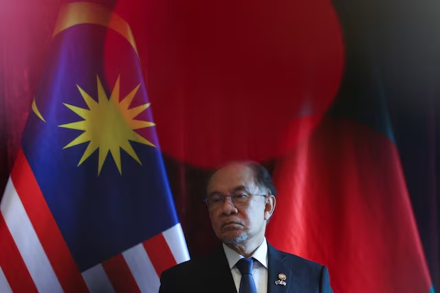 Malaysian Prime Minister Anwar Ibrahim looks on during a press conference at Putrajaya, Malaysia, August 12, 2025. REUTERS/Hasnoor Hussain/Pool/File Photo