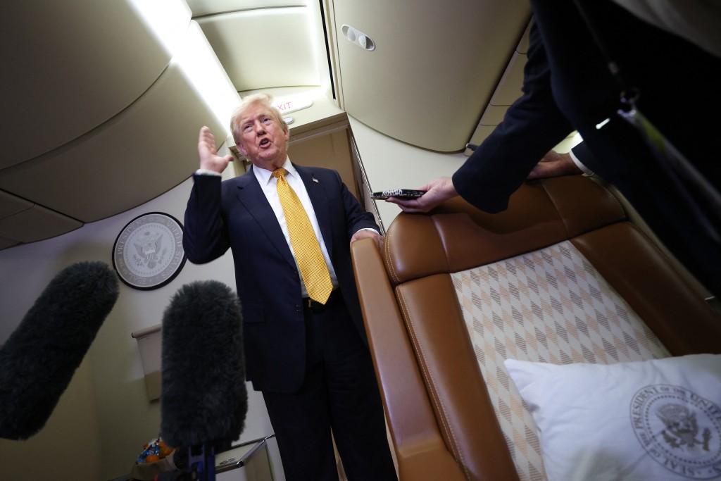 U.S. President Donald Trump speaks to members of the press for the first time aboard the new Air Force One while in flight from RAF Mildenhall AFB to Joint Base Andrews July 8, 2026 after leaving the United Kingdom. Trump, who switched from the old Air Force One to the new Air Force One while in the U.K. is returning from his visit to Ankara, Turkey where he attended the NATO summit. Win McNamee/Getty Images/AFP