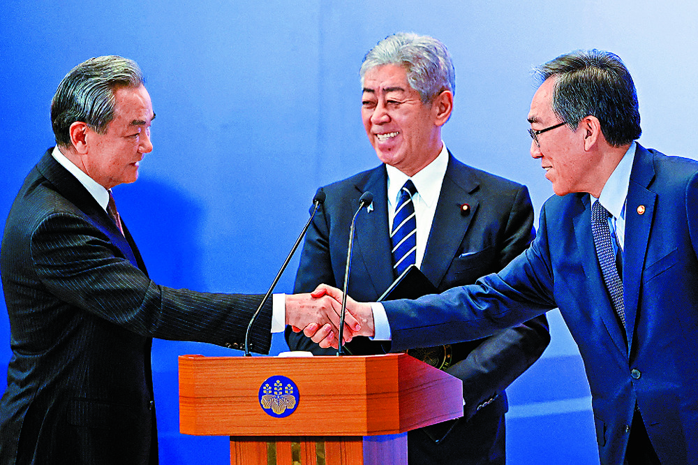 From left are Wang Yi, Cho Tae Yul and Takeshi Iwaya. REUTERS From left are Wang Yi, Cho Tae Yul and Takeshi Iwaya. REUTERS