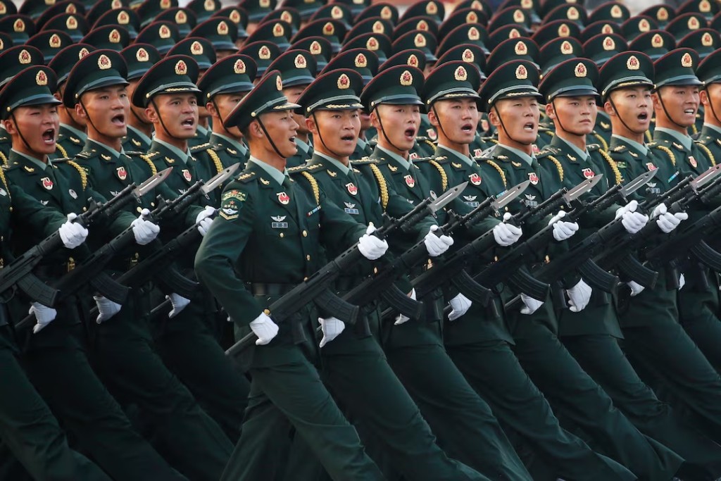 Soldiers of People's Liberation Army (PLA) march in formation past Tiananmen Square during a rehearsal before a military parade in Beijing, China October 1, 2019. REUTERS/Jason Lee/file photo