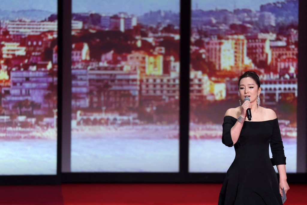 Chinese actress Gong Li speaks on stage during the Opening Ceremony and the screening of the film "La Venus electrique" (The Electric Kiss) at the 79th edition of the Cannes Film Festival in Cannes, southern France, on May 12, 2026. (Photo by Sameer AL-DOUMY / AFP)