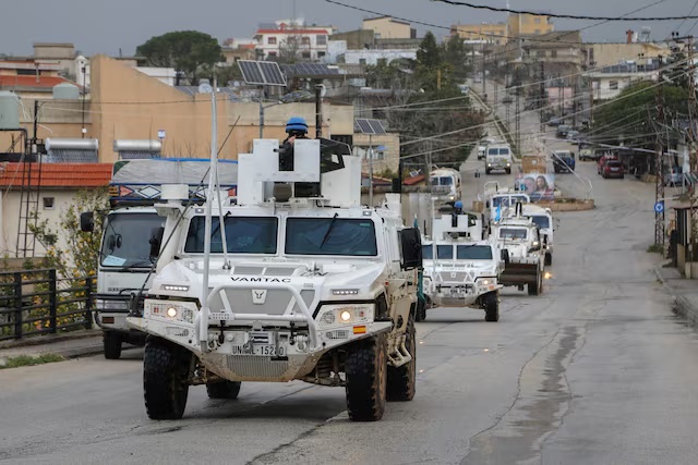 UNIFIL vehicles drive on a main road in Qlayaa, amid escalating hostilities between Israel and Hezbollah, as the U.S.-Israel conflict with Iran continues, in Qlayaa, southern Lebanon, March 27, 2026. REUTERS/Karamallah Daher